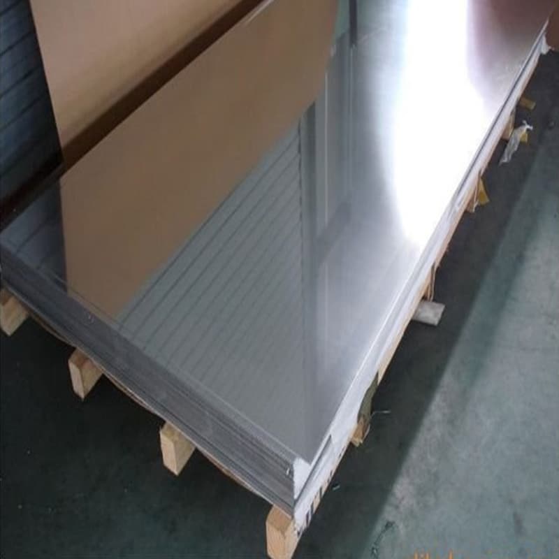 Quality control inspector verifying chemical composition on an ASTM A240 304 stainless steel plate