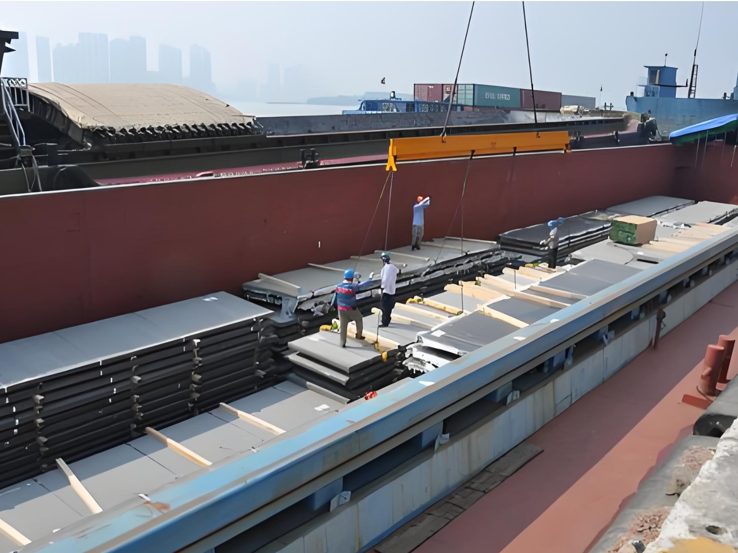 Custom packaged structural H-beams and steel sections secured inside shipping container Custom packaged structural H-beams and steel sections secured inside shipping container